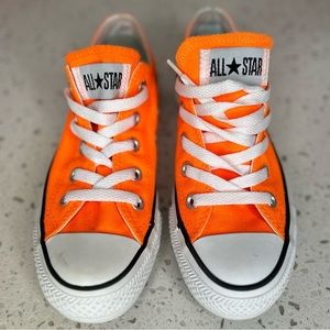 Orange All Star Low Top Converse ( Women’s 6 or a Men’s 4)